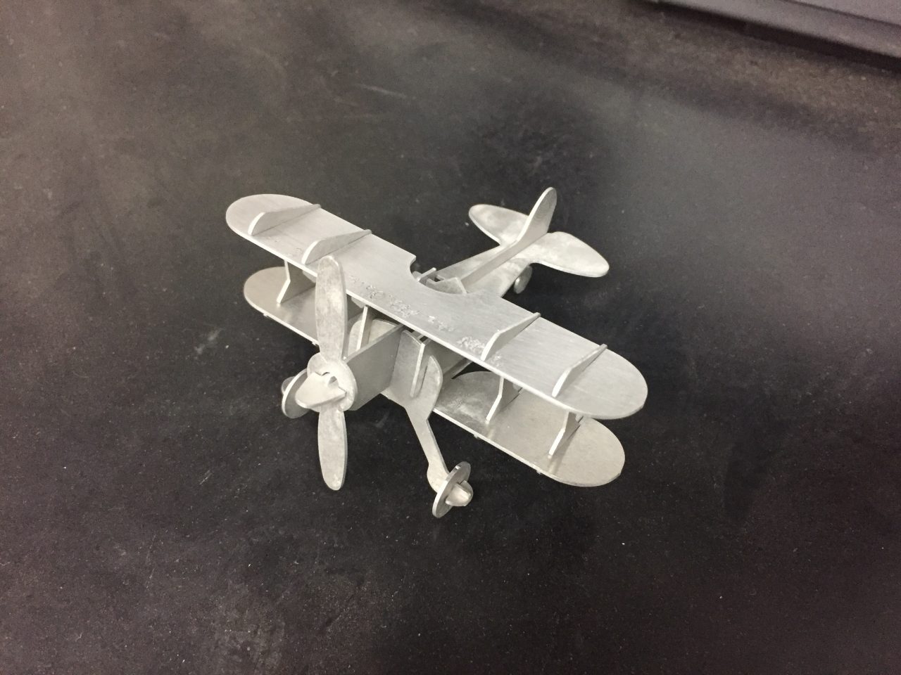 Sheet metal puzzle style airplane made by our fabrication laser